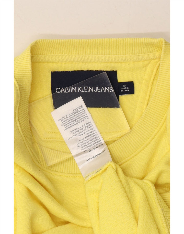 CALVIN KLEIN JEANS Womens Graphic Sweatshirt Jumper UK 14 Medium Yellow Vintage Calvin Klein Jeans and Second-Hand Calvin Klein Jeans from Messina Hembry 