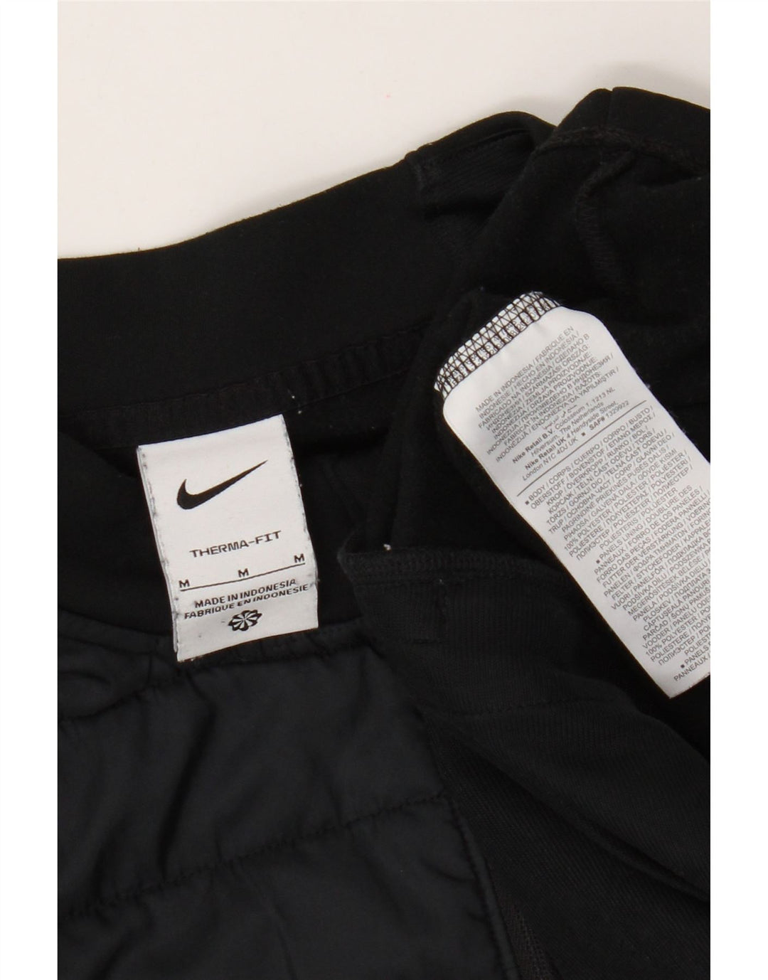 Мужской спортивный костюм-пуловер Nike Therma-Fit среднего черного цвета с цветными блоками