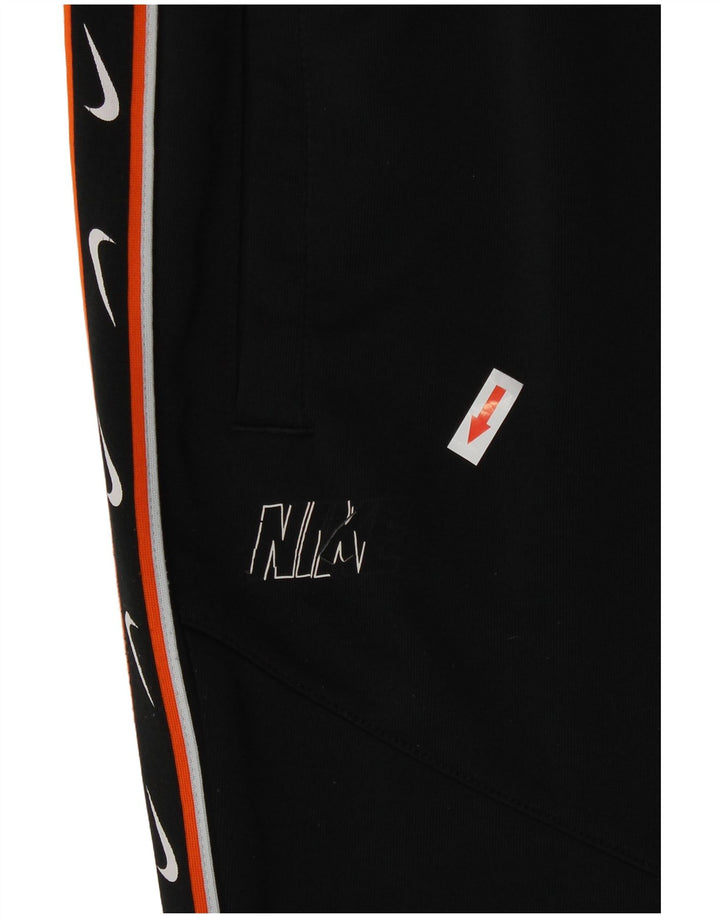 Женские спортивные брюки с графическим принтом Nike UK 14, средний черный полиэстер