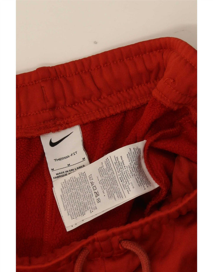Мужские спортивные брюки Nike Therma-Fit с графическим рисунком, средний красный полиэстер