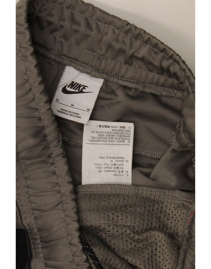 Мужские спортивные брюки NIKE джоггеры среднего серого цвета из полиэстера с цветными блоками