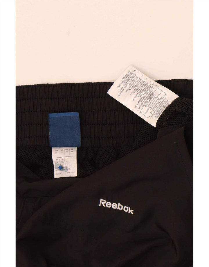 Женские спортивные брюки Reebok UK 12, средний черный, полиэстер