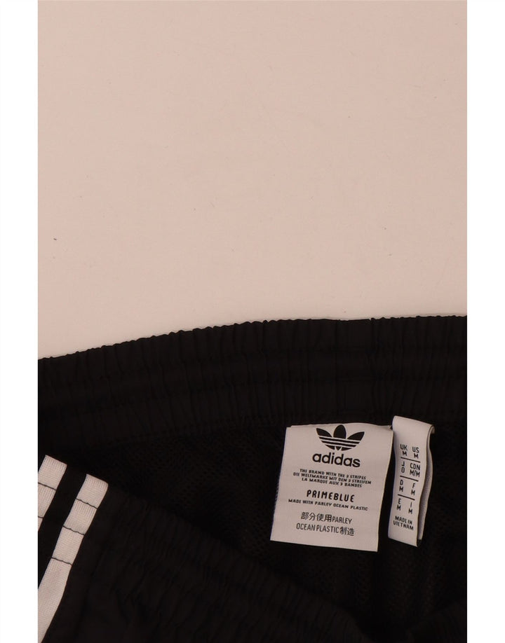 Adidas Мужские спортивные брюки с графическим рисунком Брюки для бега Средний черный полиэстер