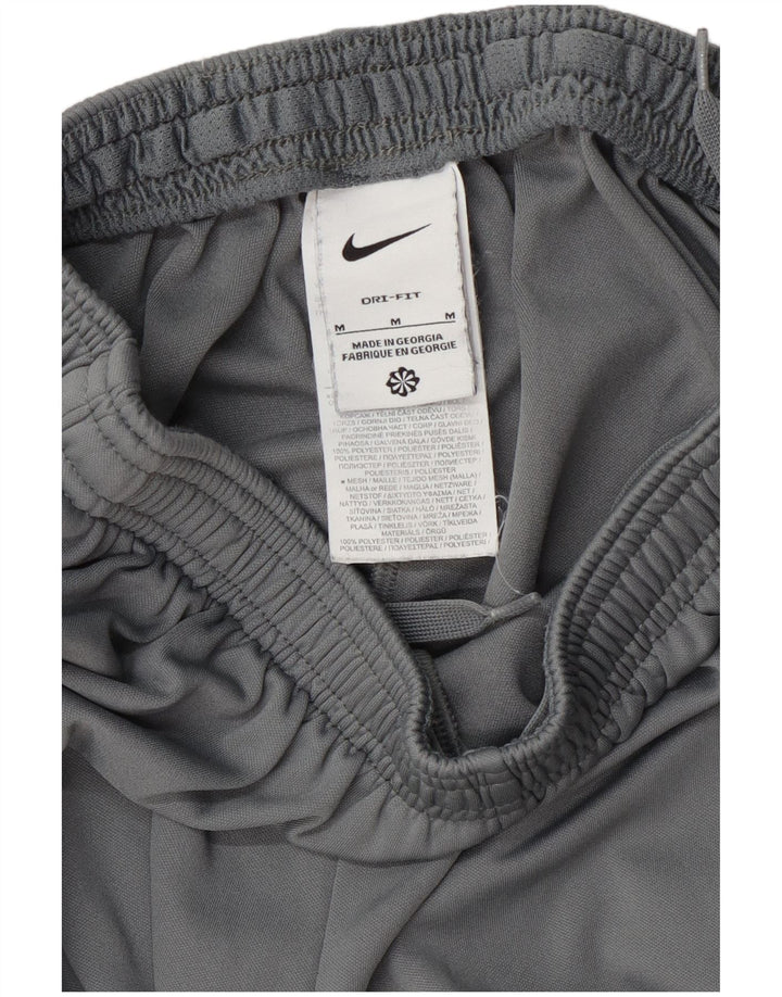 Мужские спортивные брюки Nike Dri Fit среднего серого цвета из полиэстера с цветными блоками
