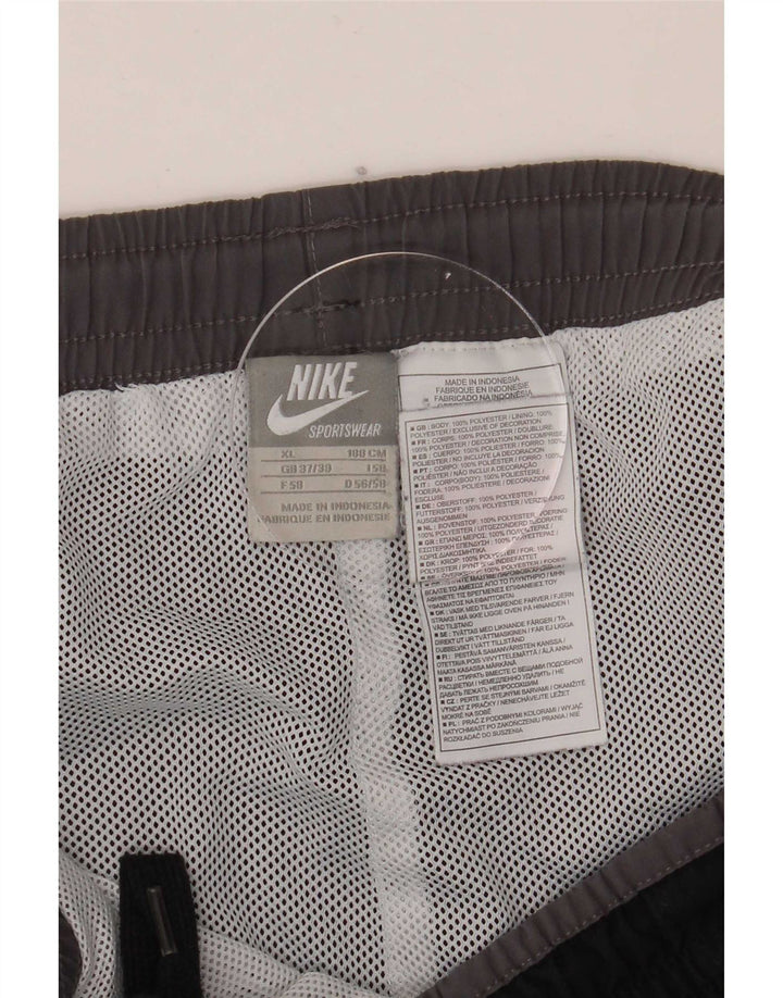 Мужские спортивные брюки с графическим рисунком Nike XL, черный полиэстер