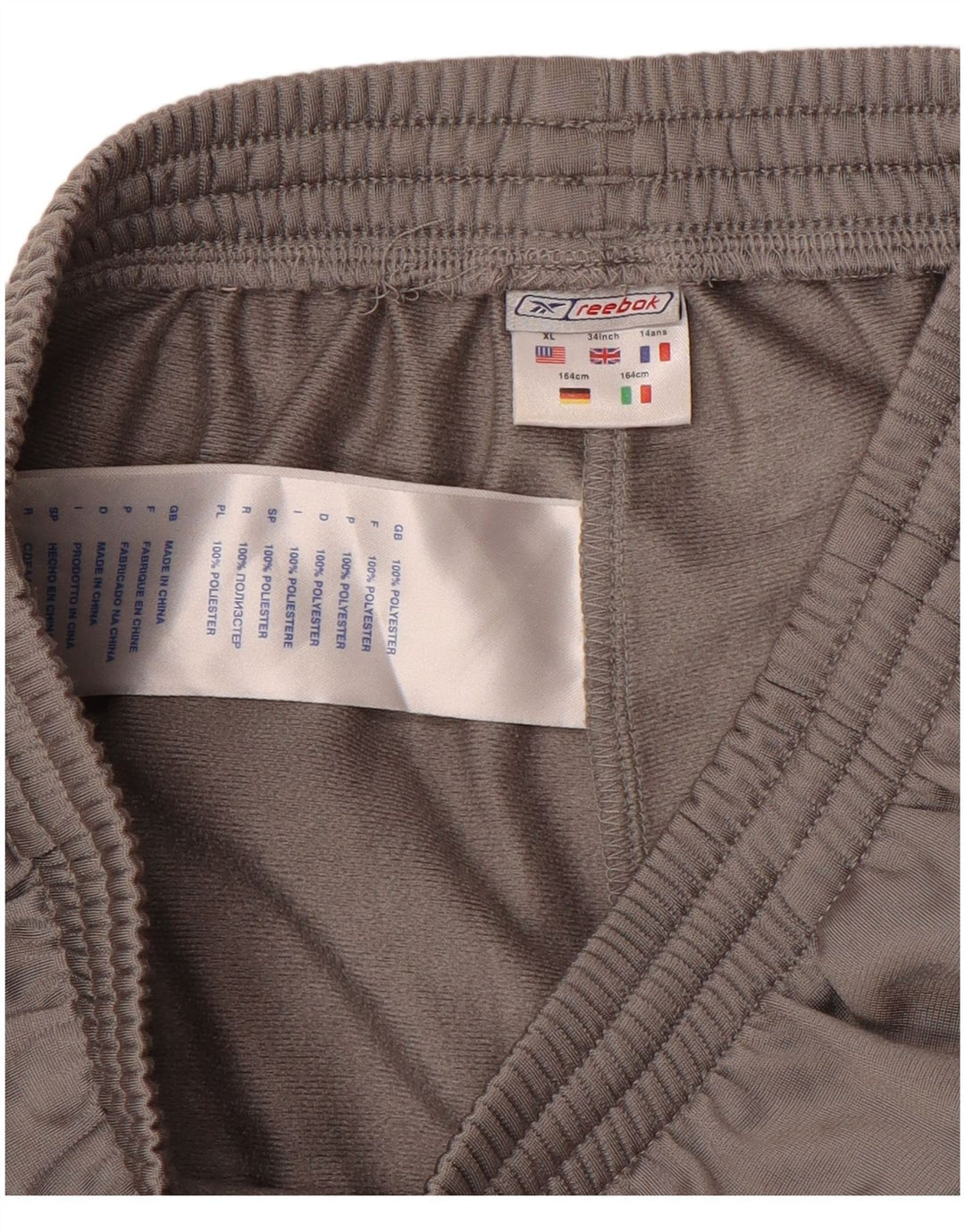 Спортивные брюки Reebok для мальчиков с графическим рисунком 13-14 лет, серый полиэстер