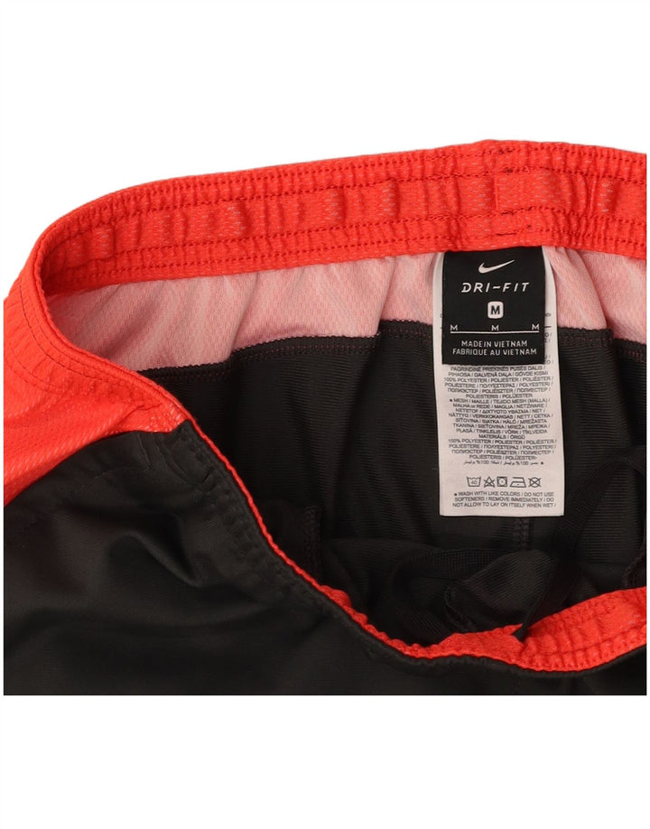 Мужские спортивные брюки NIKE Dri Fit среднего серого цвета из полиэстера с цветными блоками