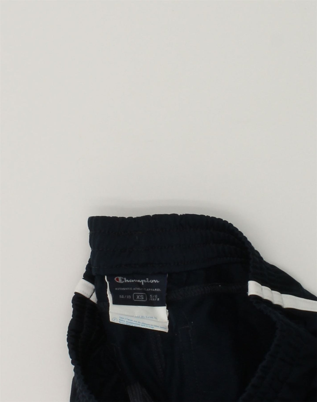 CHAMPION Boys Graphic Tracksuit Trousers 5-6 Years XS Navy Blue Polyester | Vintage Champion | Thrift | Second-Hand Champion | Used Clothing | Messina Hembry 