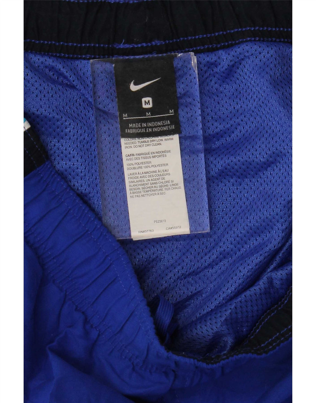 Мужские спортивные шорты Nike среднего синего цвета из полиэстера с цветными блоками