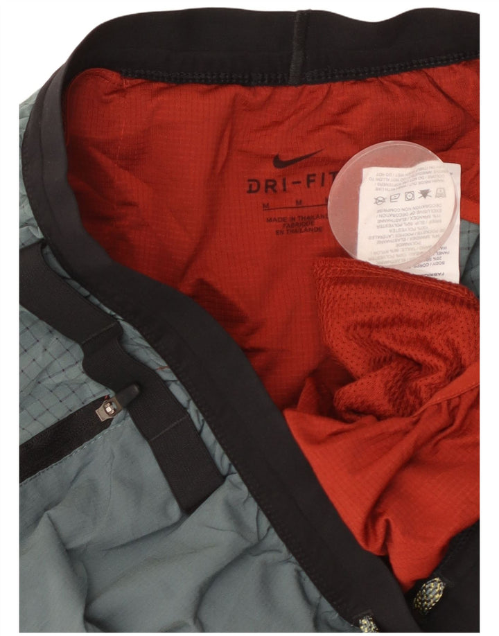 Мужские спортивные шорты Nike среднего красного цвета из полиэстера с цветными блоками