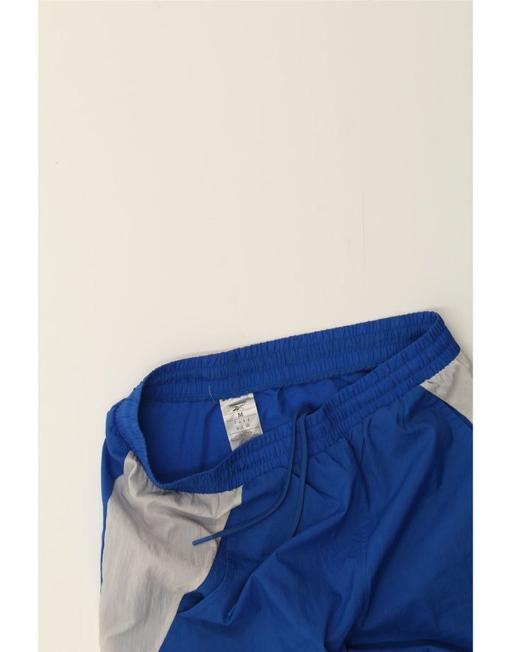 REEBOK Mens Tracksuit Trousers Joggers Medium  Blue Colourblock Polyamide Vintage Reebok and Second-Hand Reebok from Messina Hembry 